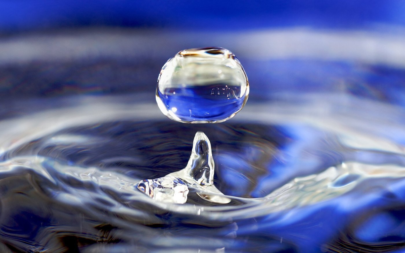 A water droplet falling into water