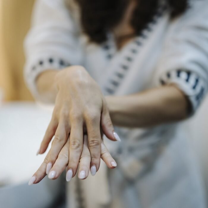 Hands applying a cream